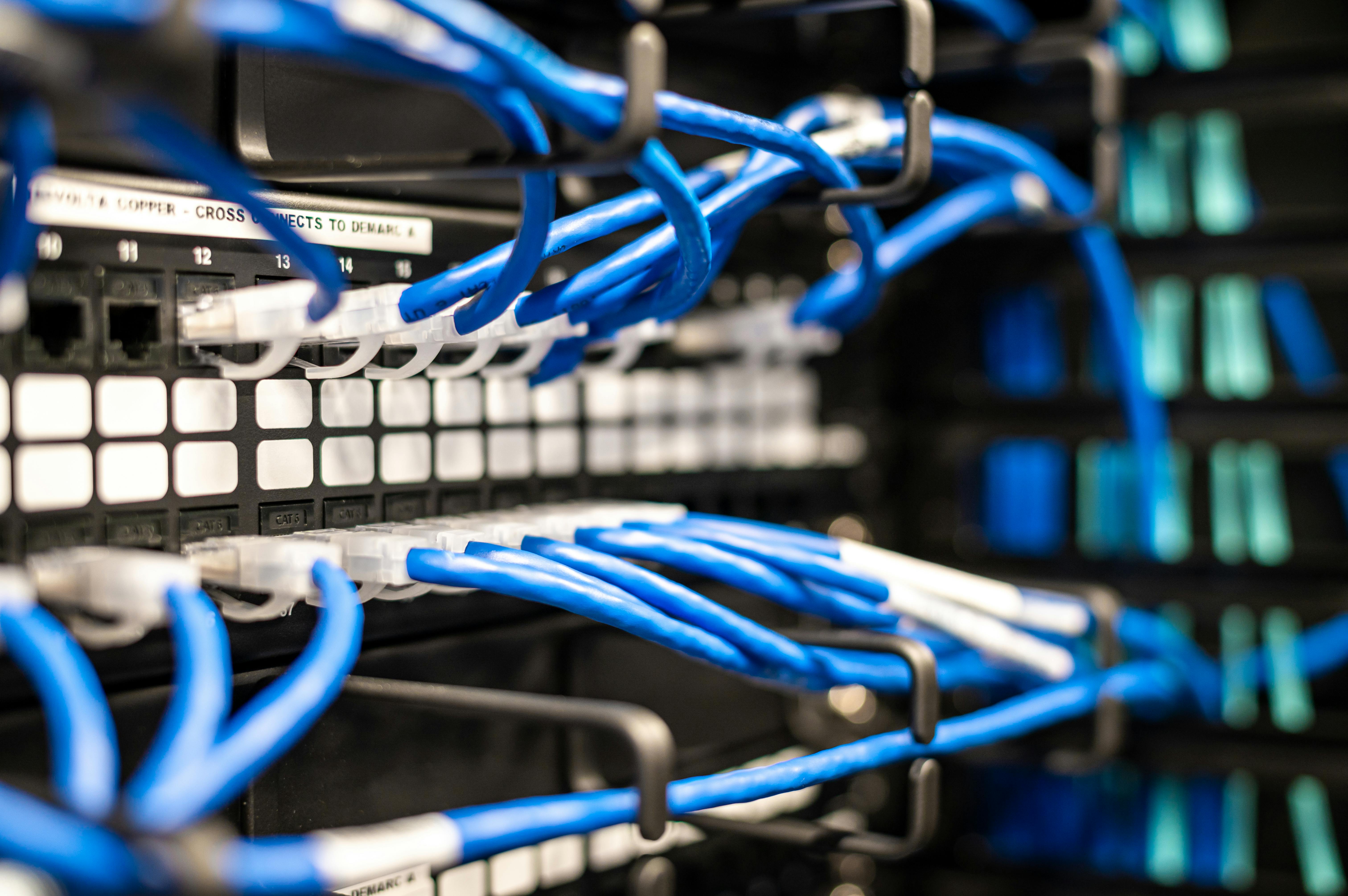 Professional network setup including routers and cabling in an office space